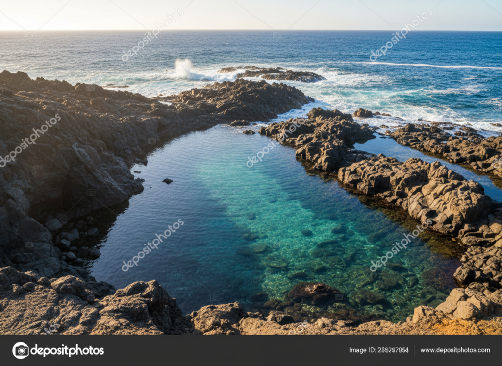 Crystal clear natural sea pool among black volcanic rocks on the coast of El Hierro