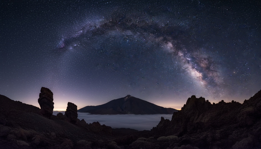 The Milky Way over Mount Teide and the volcanic landscape of Teide National Park at night