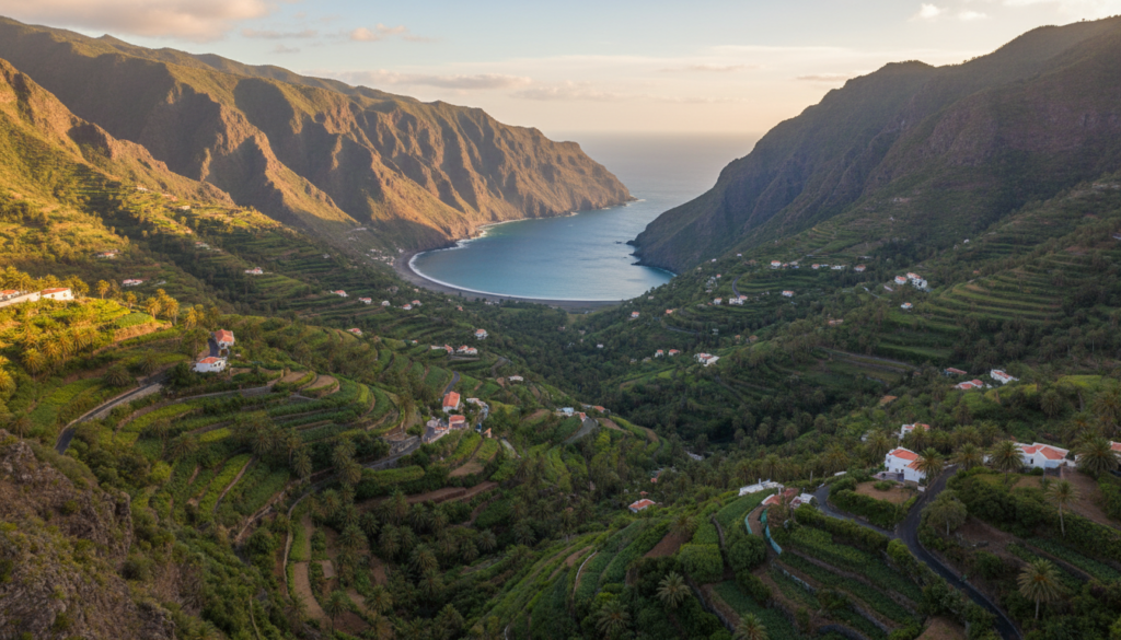 Terraced green valley with palm trees running down to the sea at Valle Gran Rey, La Gomera